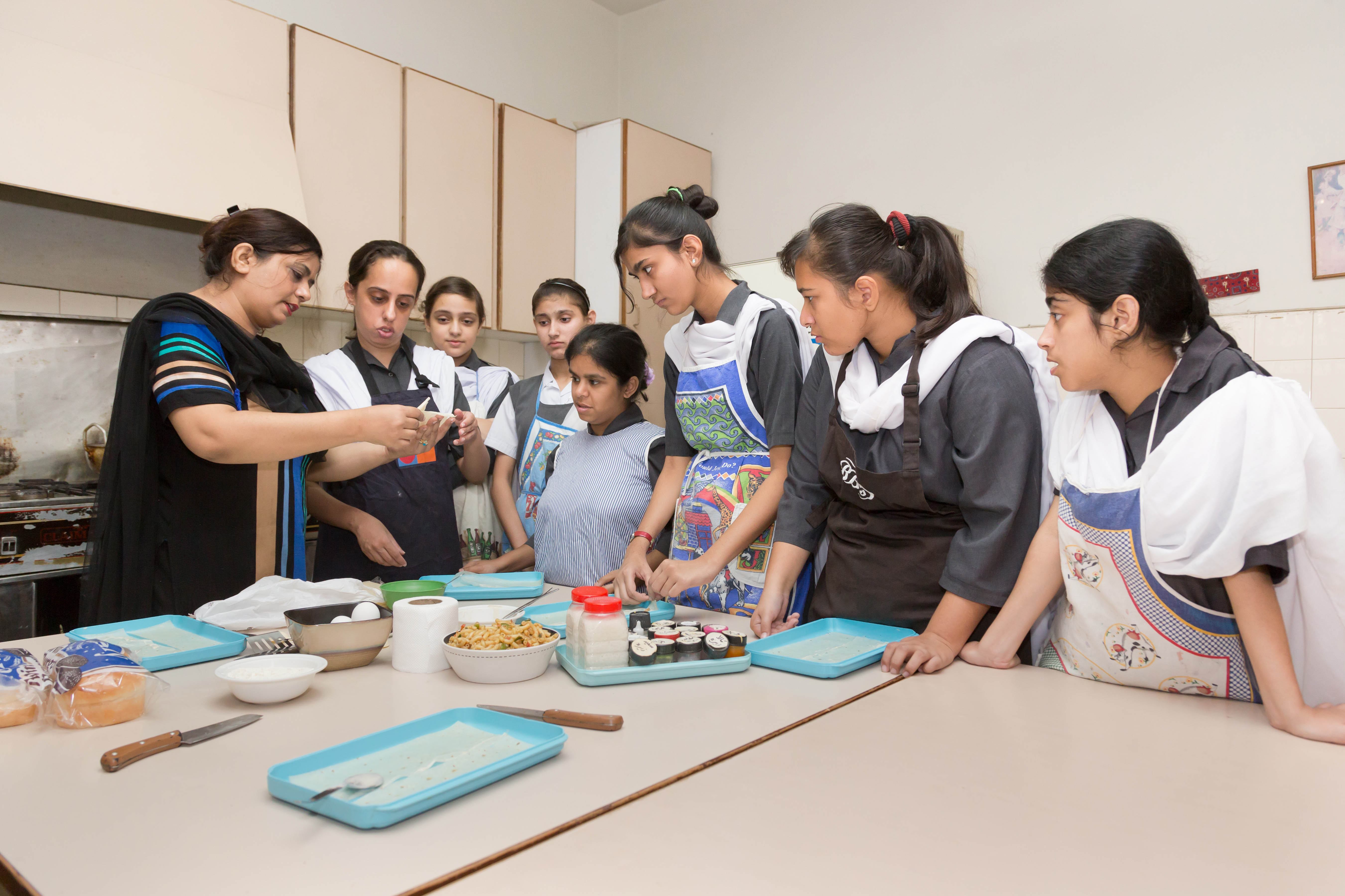 Students engaged in a colorful sensory development arts session
